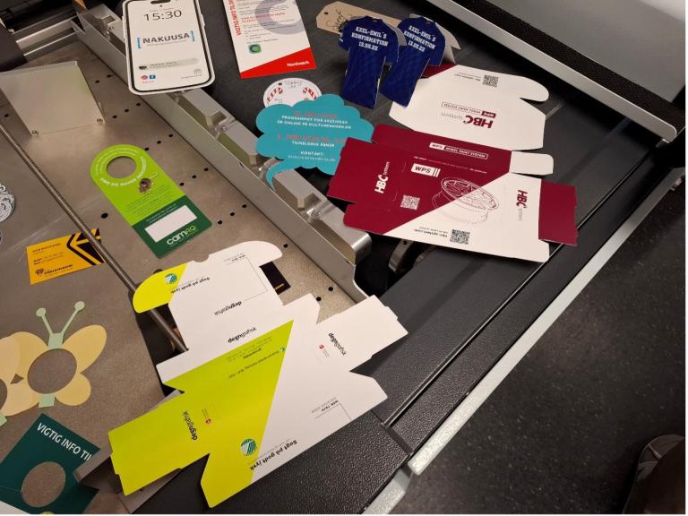 The roll feed unit on Duplo’s PFi Blade B2 cutting table can also be simply removed to handle printed sheets for processing a wide variety of packaging and POS material